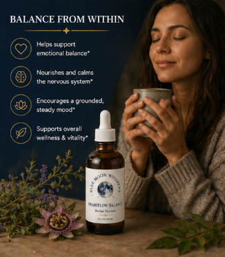 Woman holding a mug with a bottle of heartflower balance supplement on a wooden surface with plants.